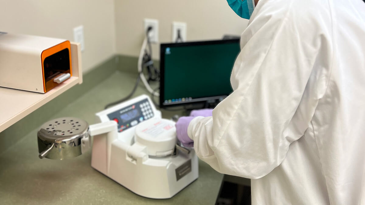 lab technician using equipment